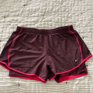 Burgundy Nike Dri-Fit running shorts. Size Large
